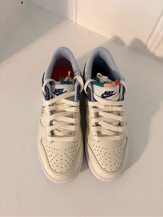 Nike Shoes - Nike Cream Low-Top Sneakers with Navy and Teal Accents